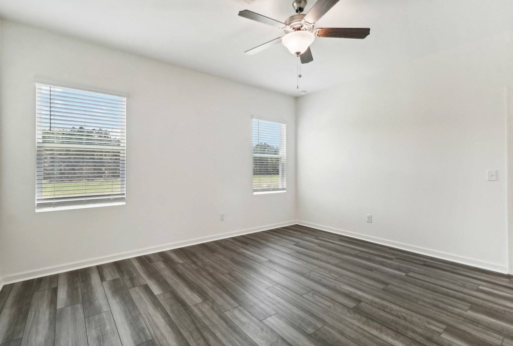 Oak bright and open living area with large windows at Beacon at Ashley River Landing in Summerville, SC