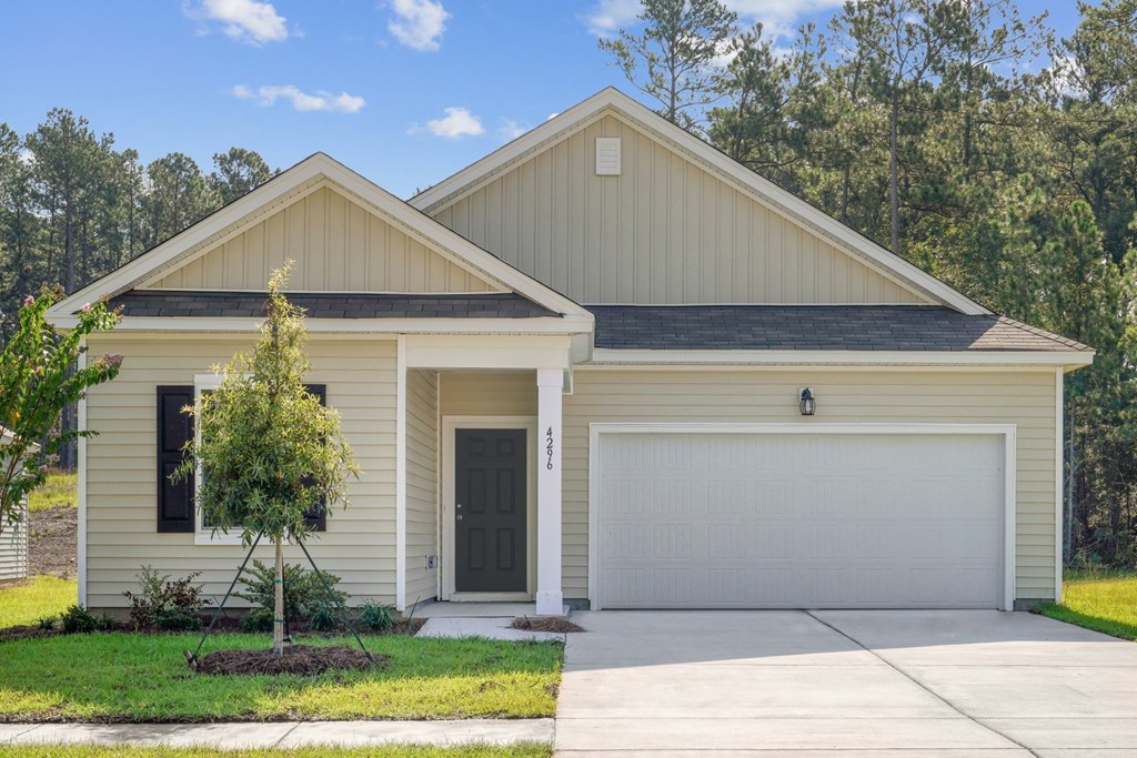 Front view of the Magnolia house painted in beige at Beacon at Ashley River Landing in Summerville, SC