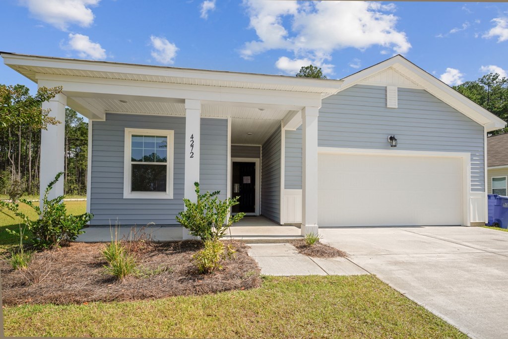 Front view of the Poplar floor home painted in a light blue at Beacon at Ashley River Landing in Summerville, SC