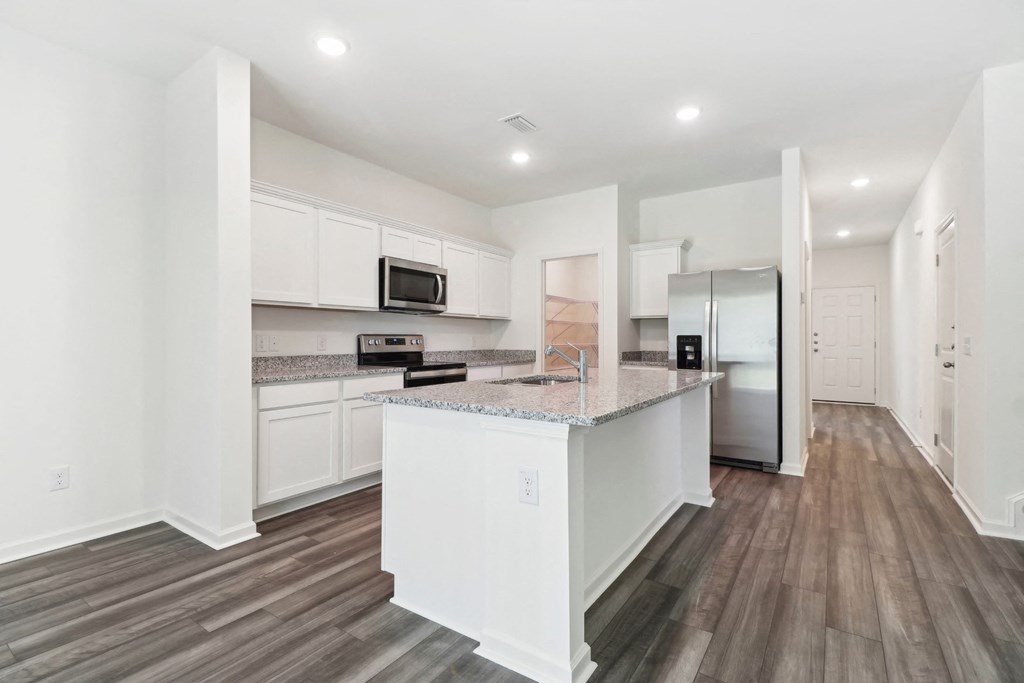 Sycamore modern kitchen with stainless steel appliances and white cabinetry at Beacon at Ashley River Landing in Summerville, SC