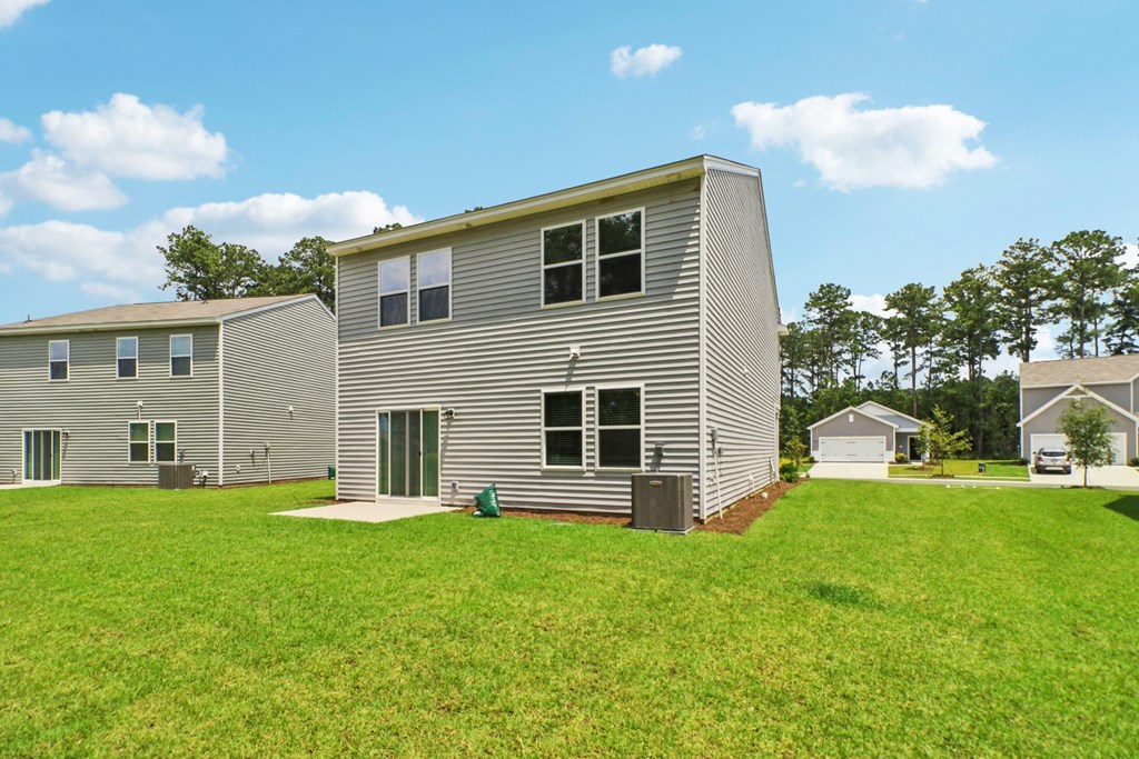 Large backyard space with air conditioning unit at Beacon at Ashley River Landing in Summerville, SC