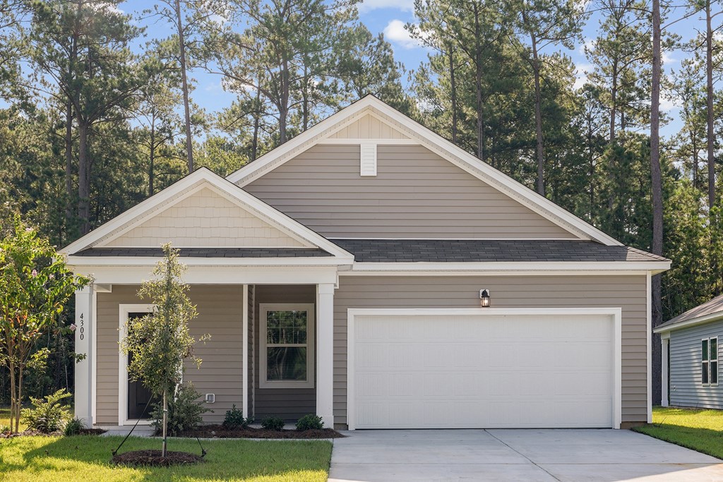 the front of a house with trees in the background at Beacon at Bunton Creek, Kyle, TX 78640