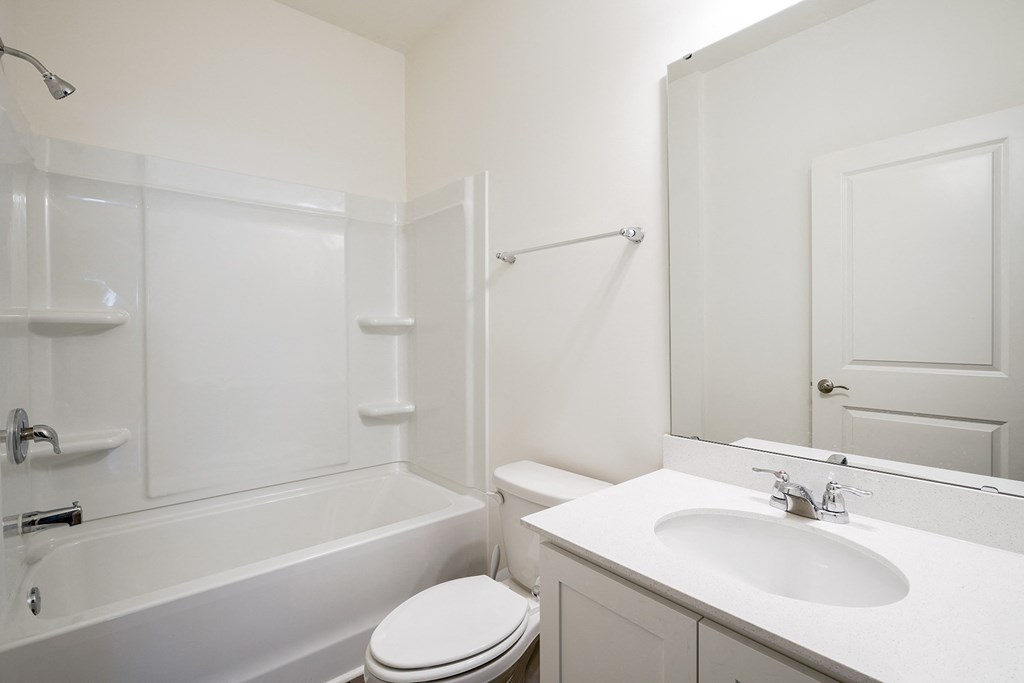 a bathroom with a sink toilet and bathtub at Beacon at Meridian, San Antonio, 78245