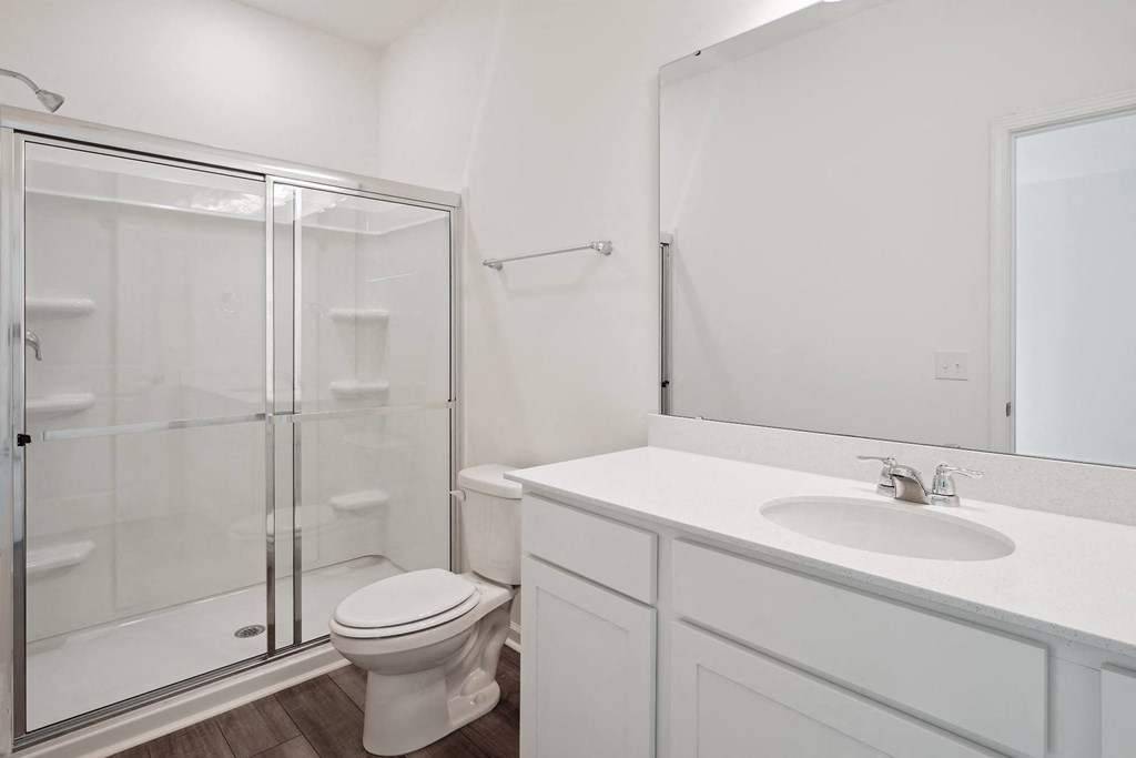 a bathroom with a toilet sink and shower at Beacon at Meridian, San Antonio, TX
