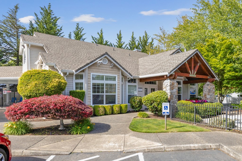 A leasing office with parking in front of it at Abbey Rowe Apartments in Olympia, WA