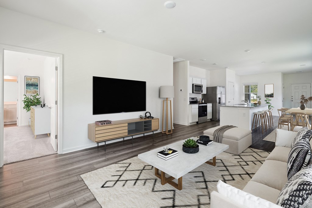 Sequoia living room furnished with couch and entertainment center at Beacon at Ashley River Landing in Summerville, SC