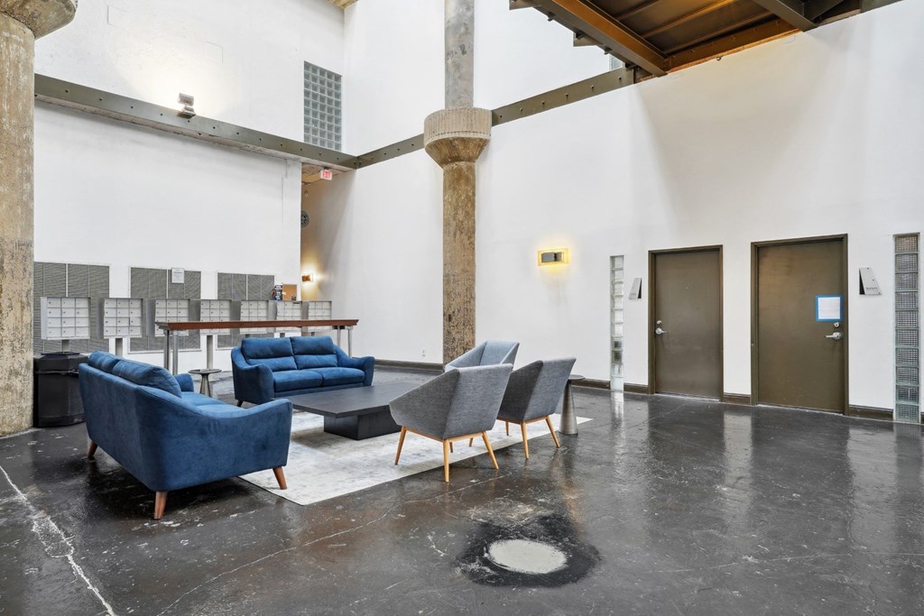 Adam Hats atrium with lounge seating | Adam Hats Lofts from Deep Ellum Lofts in Dallas, TX