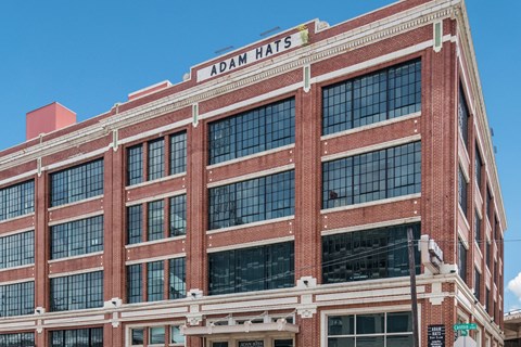 a large brick building with a sign that reads 40mm hass