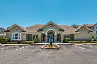 a large house with a driveway and a parking lot