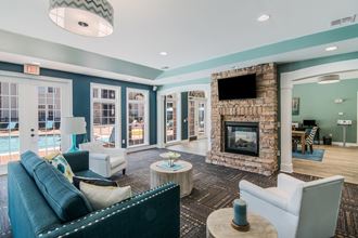 a living room with a fireplace and blue walls