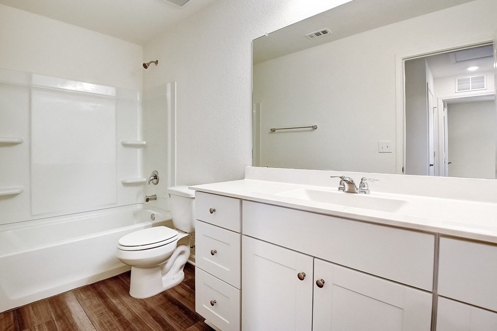 a bathroom with a toilet sink and bathtub