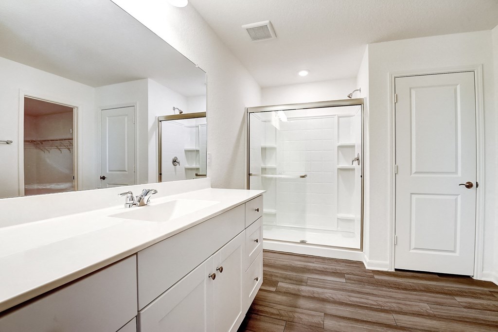Ash master bathroom with large vanity and stand-up shower at Beacon at Ashley River Landing in Summerville, SC