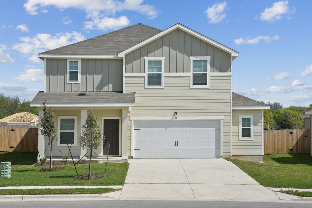 a house with a gray roof and tan siding at Beacon at Bunton Creek, Texas