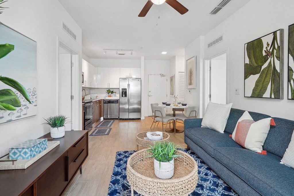 a living room with a blue couch and a coffee table
