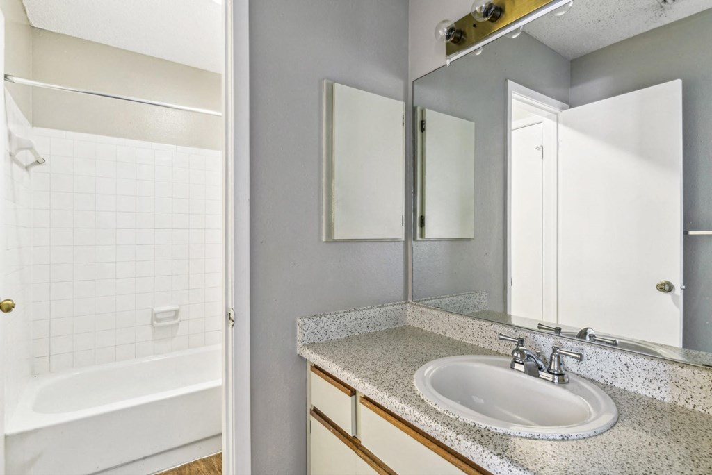 Modern bathroom with soaking tub at Bandera Crossing apartments in San Antonio, TX