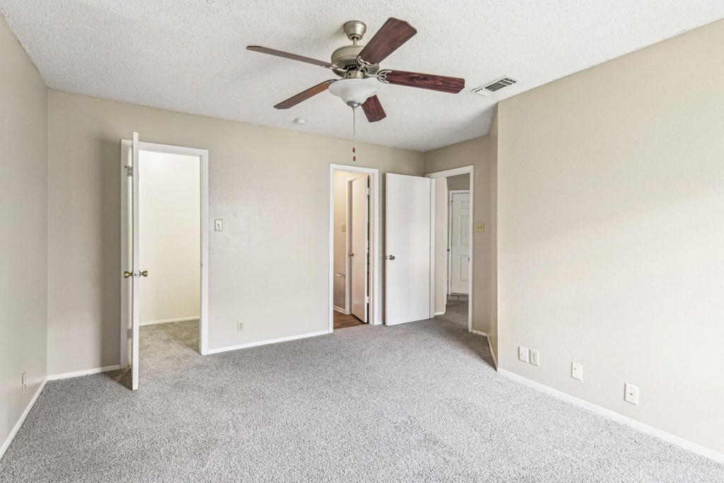 Spacious bedroom with ample natural light at Bandera Crossing apartments in San Antonio, TX