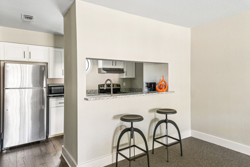 Clubhouse kitchen with island bar at Bandera Crossing apartments in San Antonio, TX