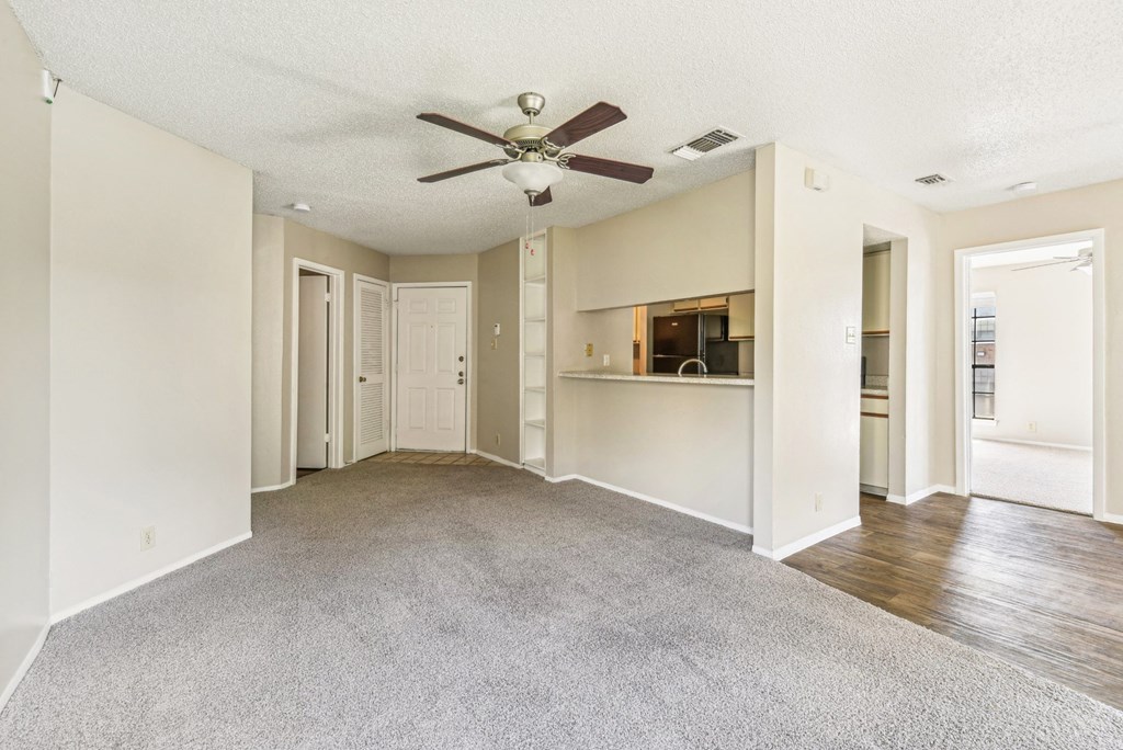 Open concept living room with high ceilings at Bandera Crossing apartments in San Antonio, TX