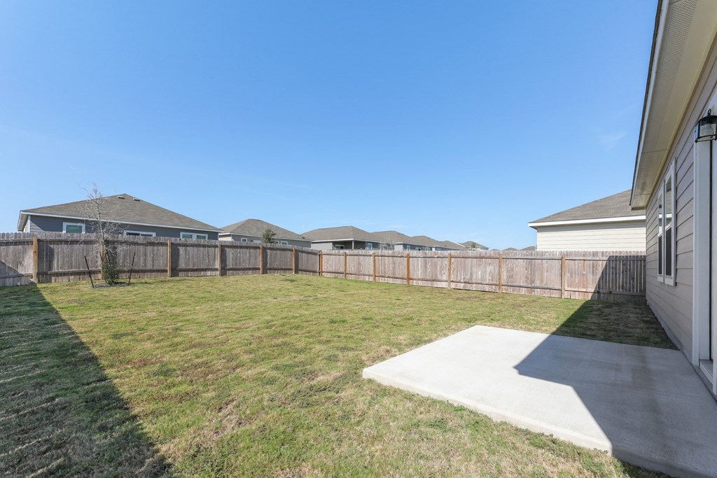 Spacious fenced backyard of Dogwood floor plan at Beacon at Presidential Heights in Manor, TX