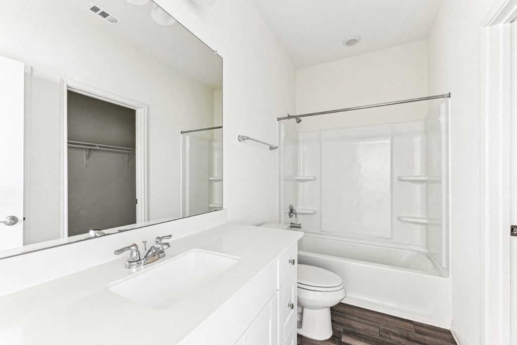 Clean and modern bathroom with a vanity and shower of Dogwood floor plan at Beacon at Presidential Heights in Manor, TX