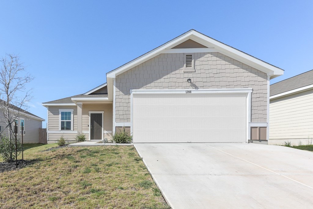 Front view of the Dogwood one-story single-family rental house at Beacon at Presidential Heights in Manor, TX