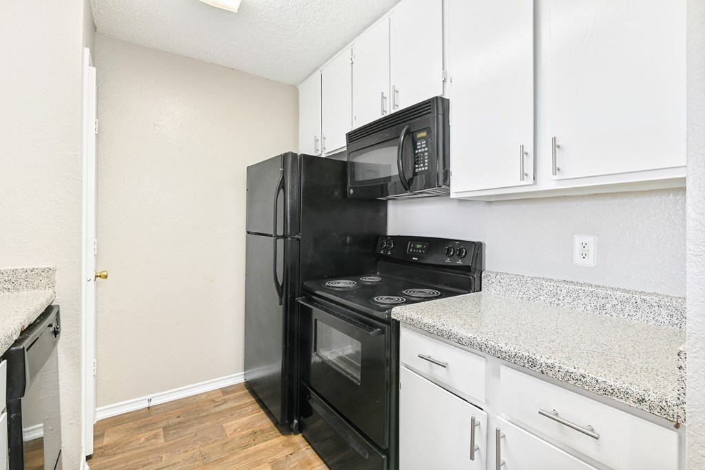 Brookstone Unit Kitchen at Bookstone and Terrace Apartments in Irving, Texas