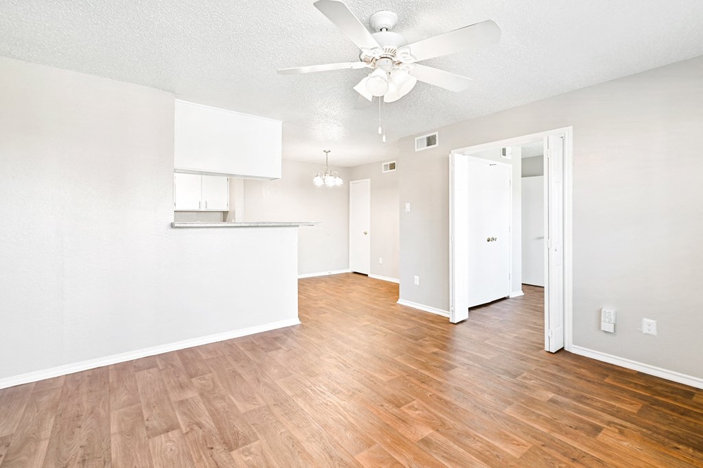 Brookstone Unit Living Area with Ceiling Fan at Bookstone and Terrace Apartments in Irving, Texas
