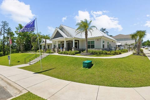The front of the leasing office with Westdale flag at Capital Grand Apartments in Tallahassee, FL