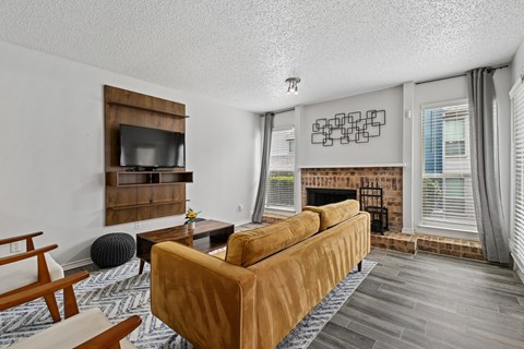 Model unit living room at Chisholm Place in Plano, TX