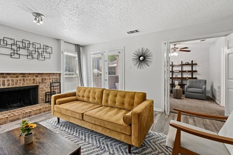 Model unit living room at Chisholm Place in Plano, TX