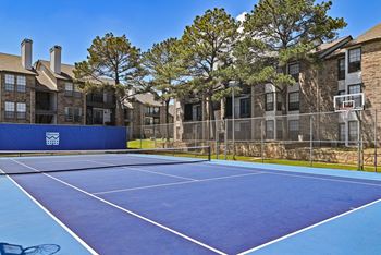 Blue tennis/sports court at Camino del Sol in Denton, TX