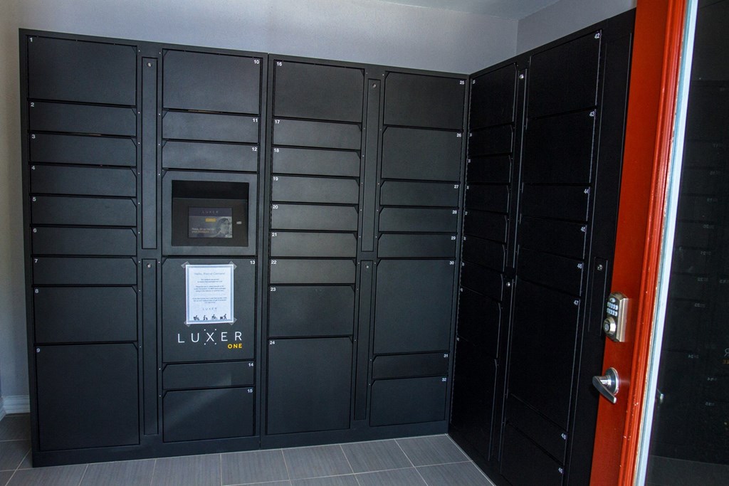 Set of lockers from Luxer One for packages at Chisholm Place Apartments in Plano, TX