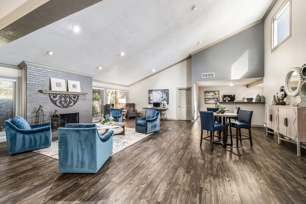 a living room with blue furniture and a fireplace