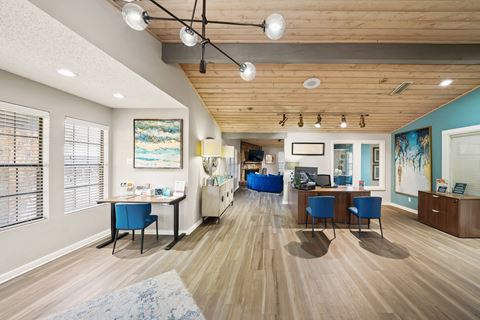 a resident clubhouse with hardwood flooring and wooden ceilings