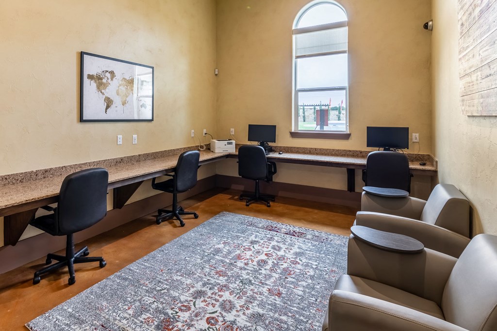 a conference room with chairs and a desk and a window