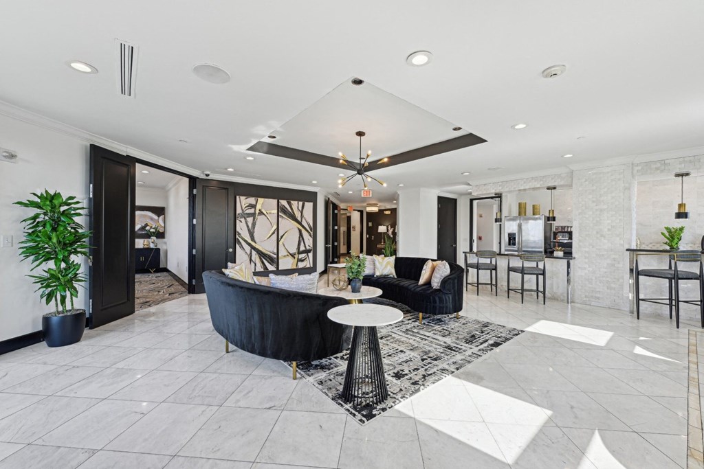 Spacious resident lounge with a black and white color scheme at Dominion Post Oak apartments in Houston, TX