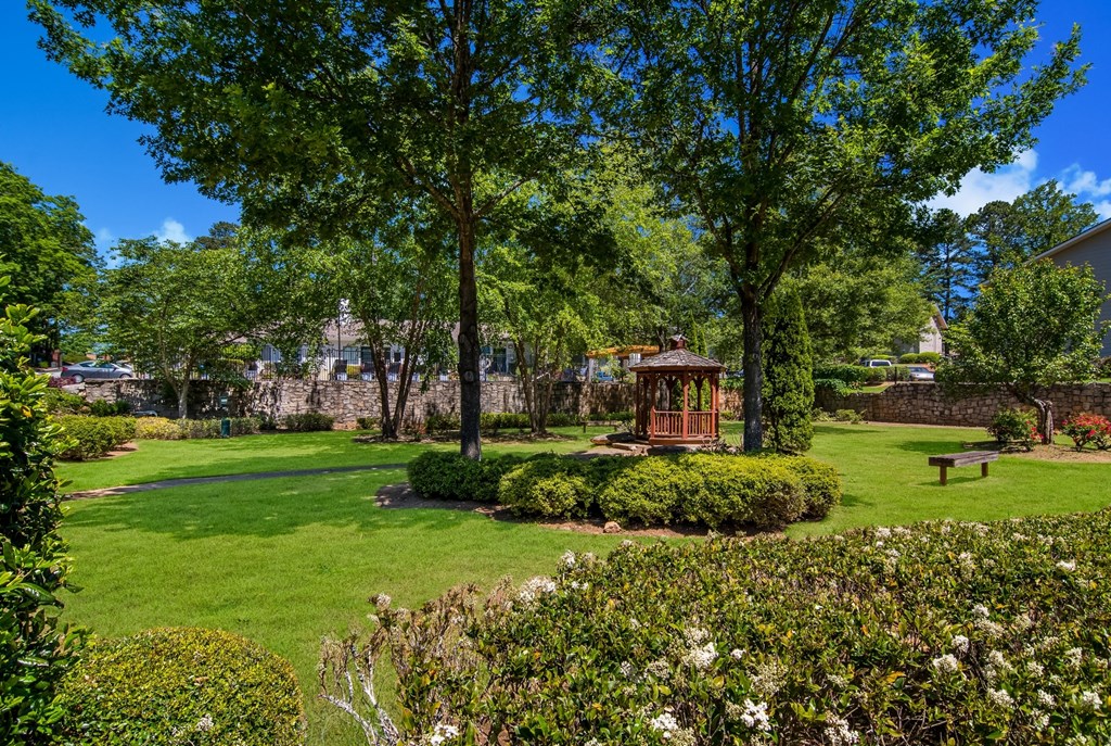 a grassland with a gazebo in the middle at Dunwoody Pointe in Sandy Springs, GA