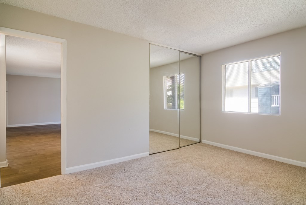 an empty bedroom with a window at Dunwoody Pointe in Sandy Springs, GA