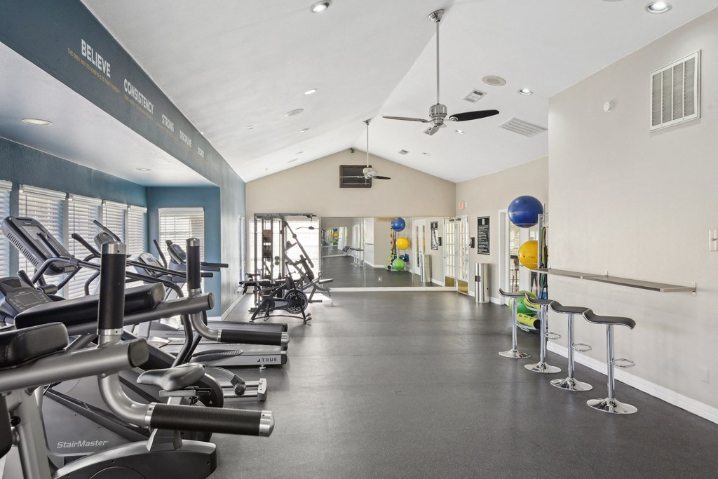Alternate view of fitness room with stools and cardio machines at Davenport Apartments in Dallas, TX