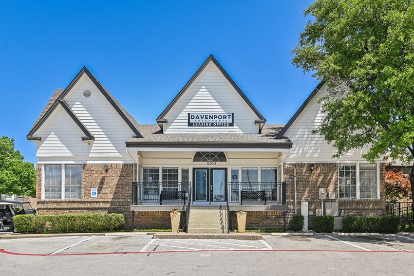 a view of the front of the bayfront apartments building with a blue sky in the background - Photo Gallery