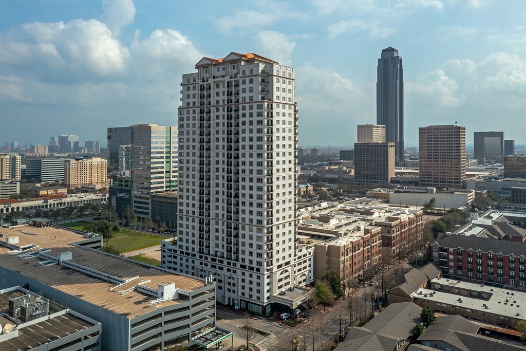 the view of apartment with skyscraper in the background at Dominion Post Oak in Houston, TX