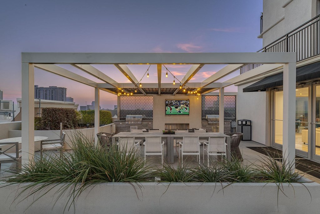Outdoor Kitchen and BBQ Grills Under Pergolas at Dominion Post Oak  in Houston, TX