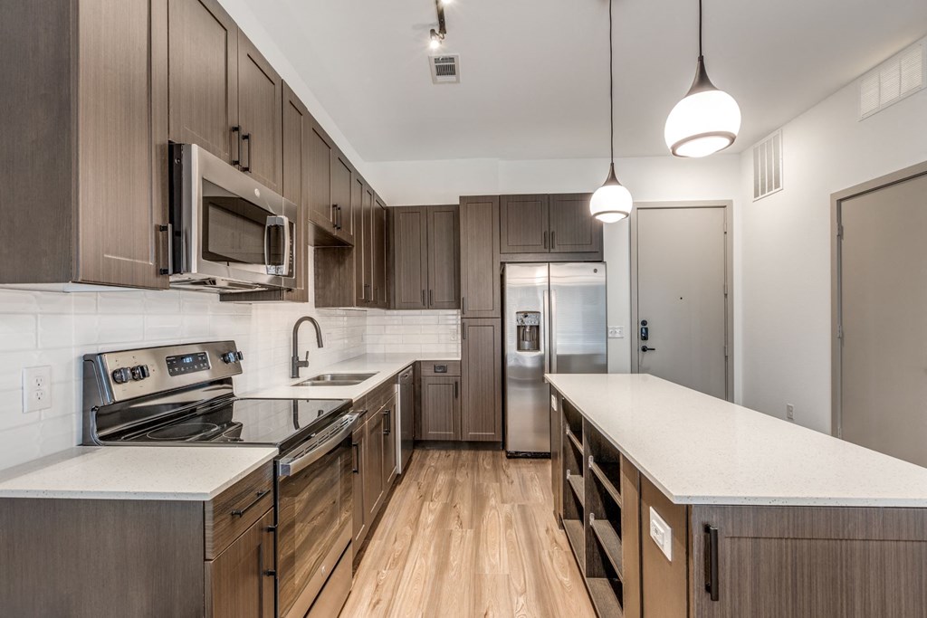 Modern Kitchen with Stainless Steel Appliances at Era Apartment in Denton, TX