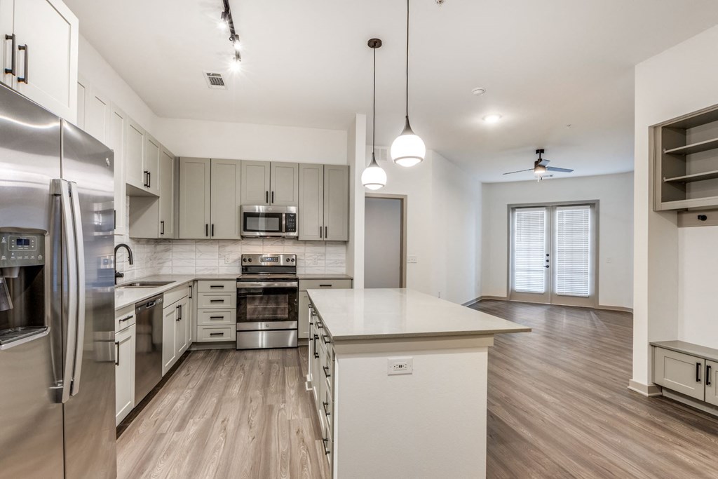 Spacious kitchen with kitchen island in 2 bedroom apartment at Era Apartment in Denton, TX