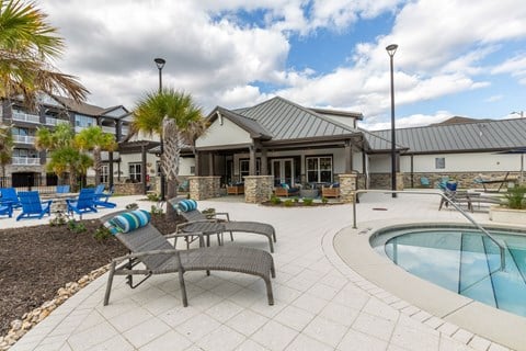 Poolside lounge chairs at Evergreen at Southwood in Tallahassee, FL