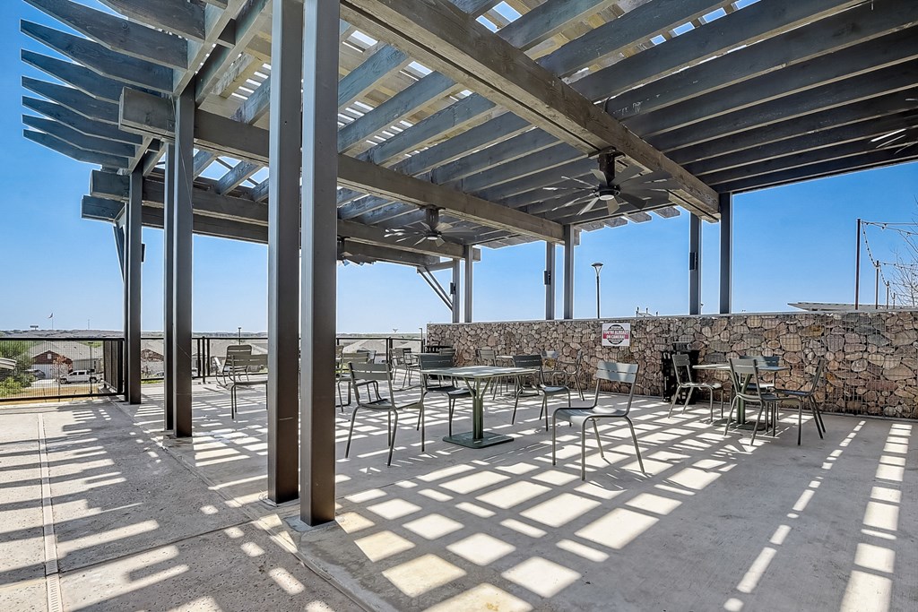 a seating area under a pergola on a sunny day at Beacon at Meridian, San Antonio, TX