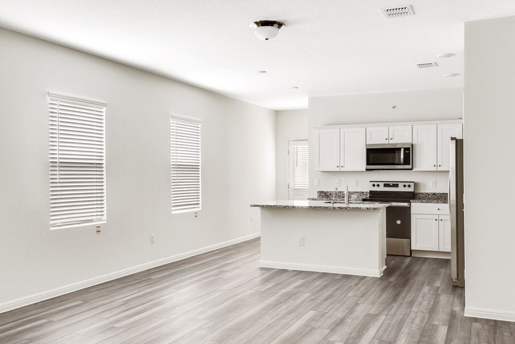 spacious dining area with white walls