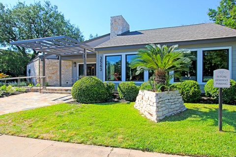 a house with a pergola in front of it