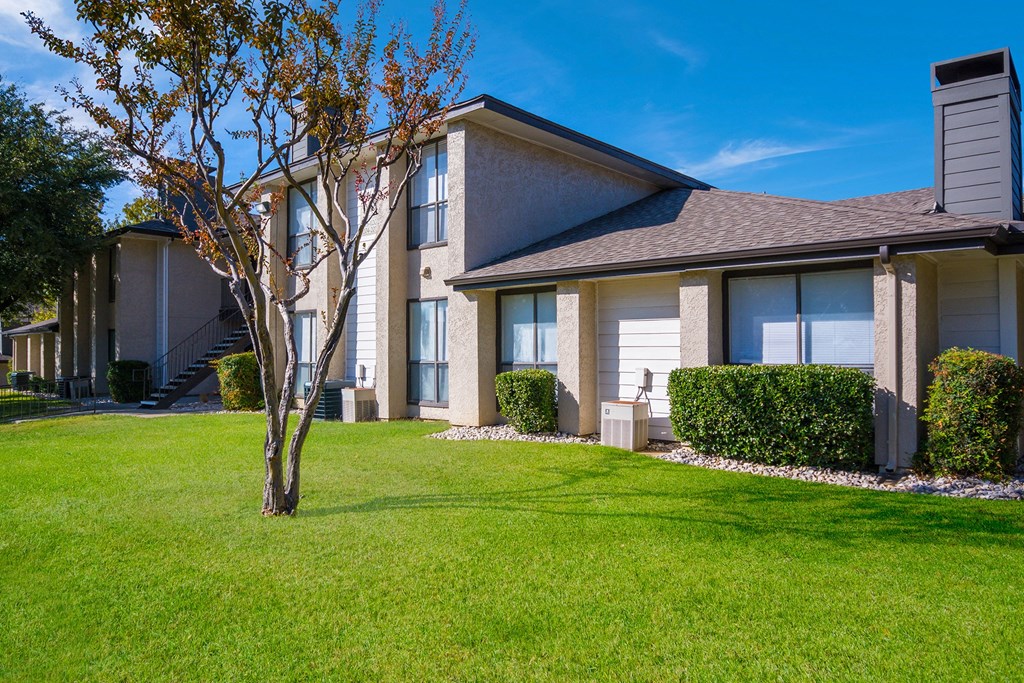 a house with a tree in front of it