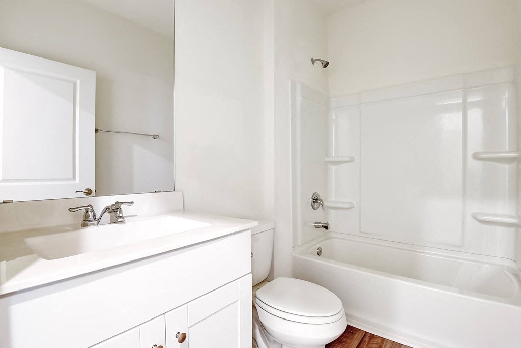 a bathroom with a sink toilet and bathtub at Beacon at Meridian, San Antonio